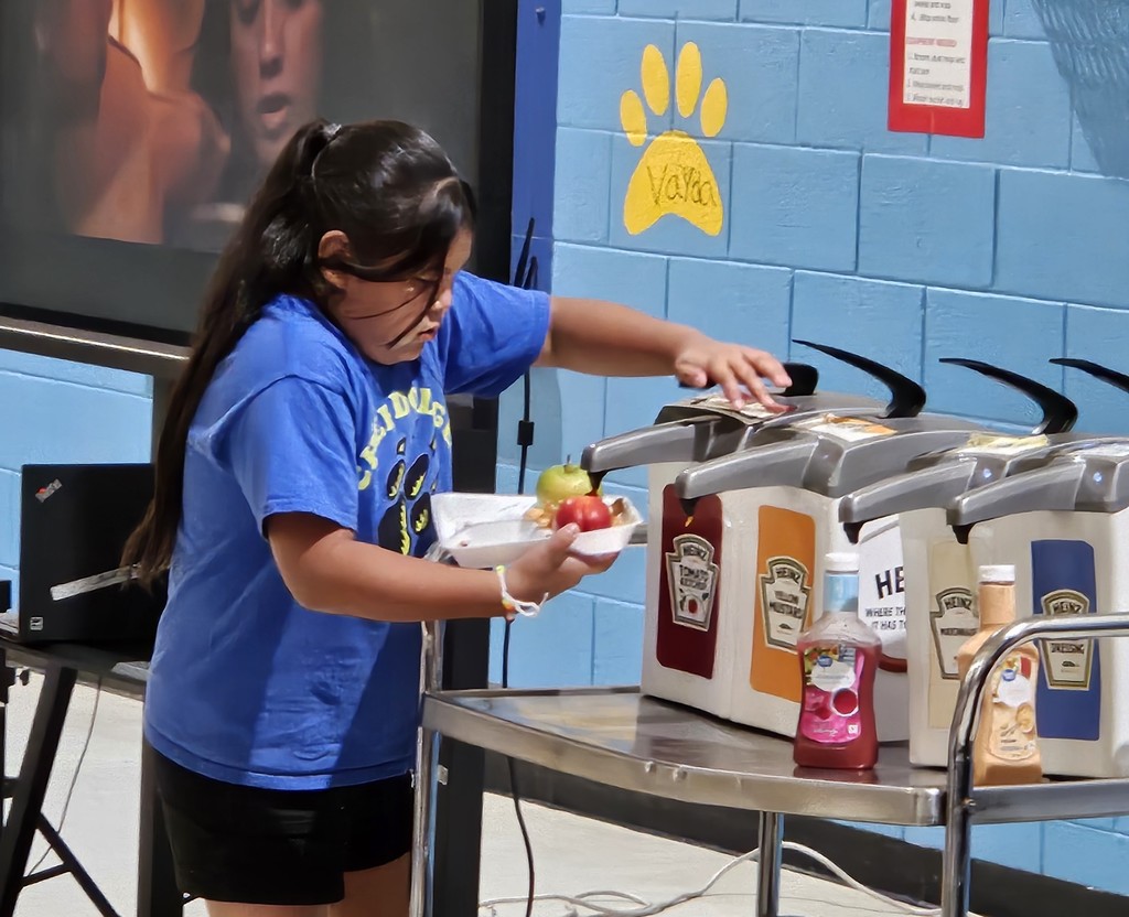 SFE staff feeding students