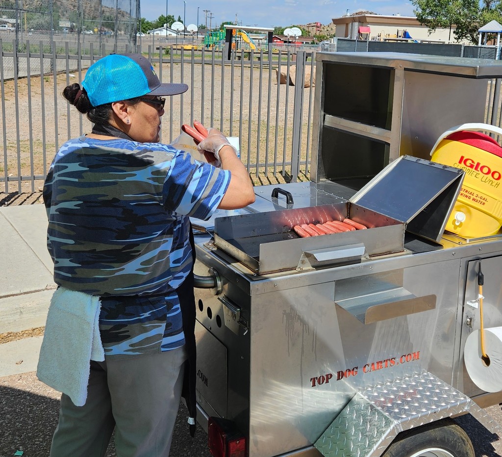 SFE staff feeding students