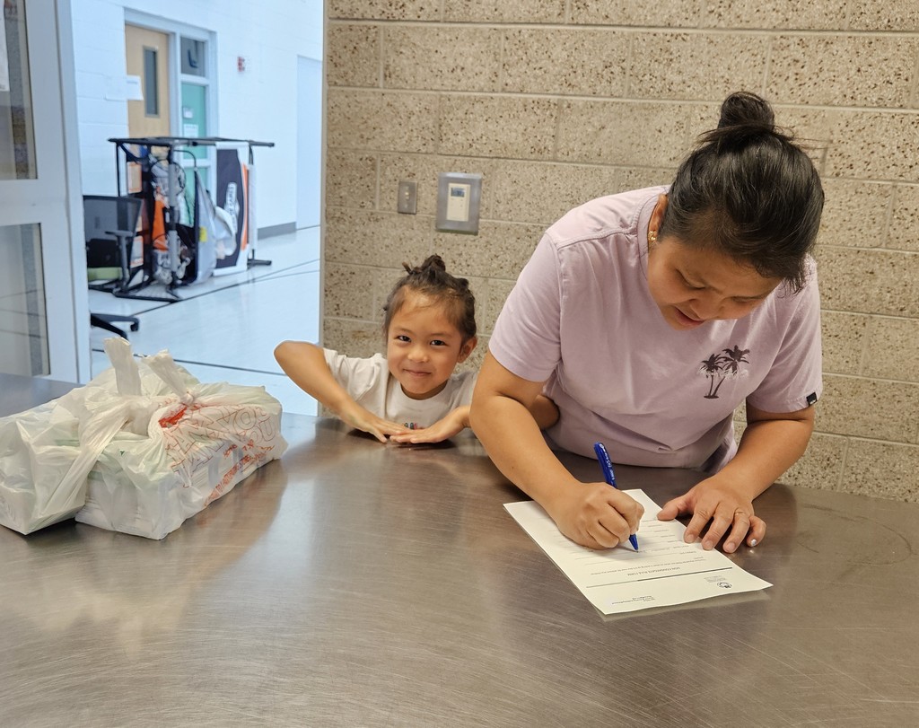 SFE staff feeding students
