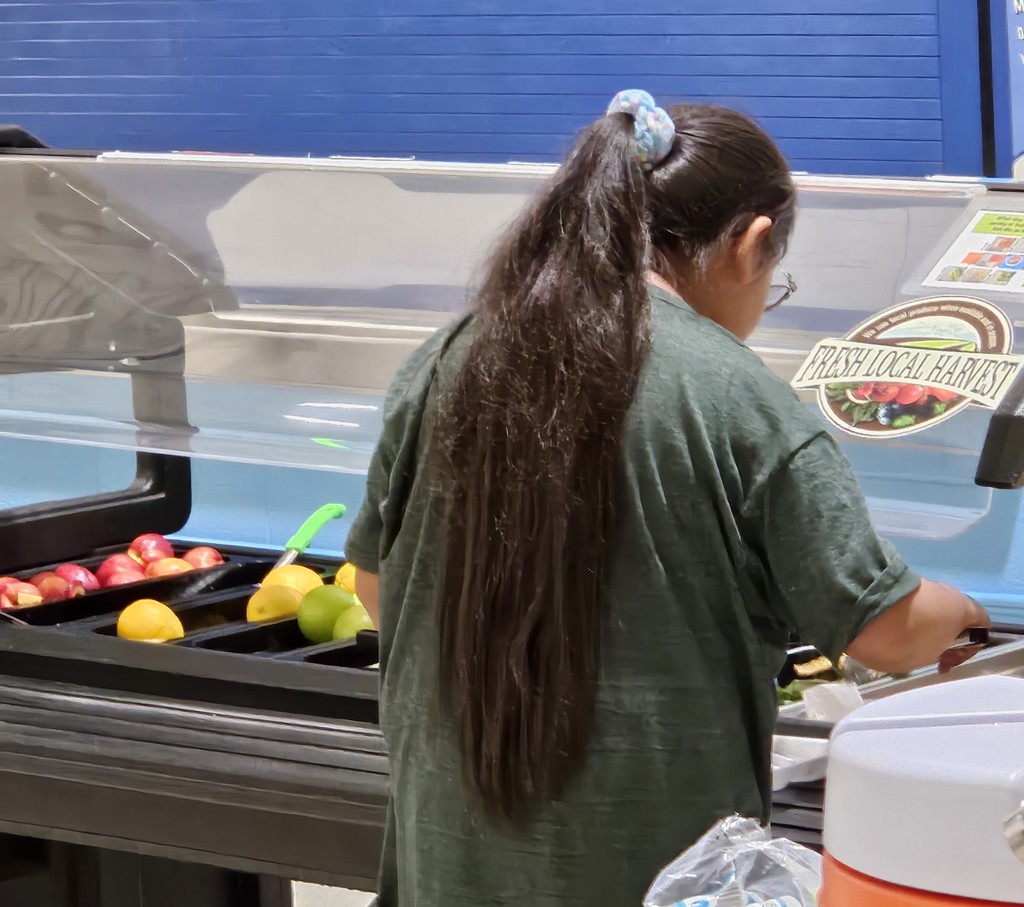 SFE staff feeding students