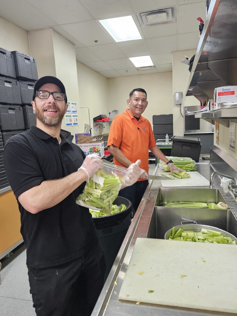 SFE staff feeding students