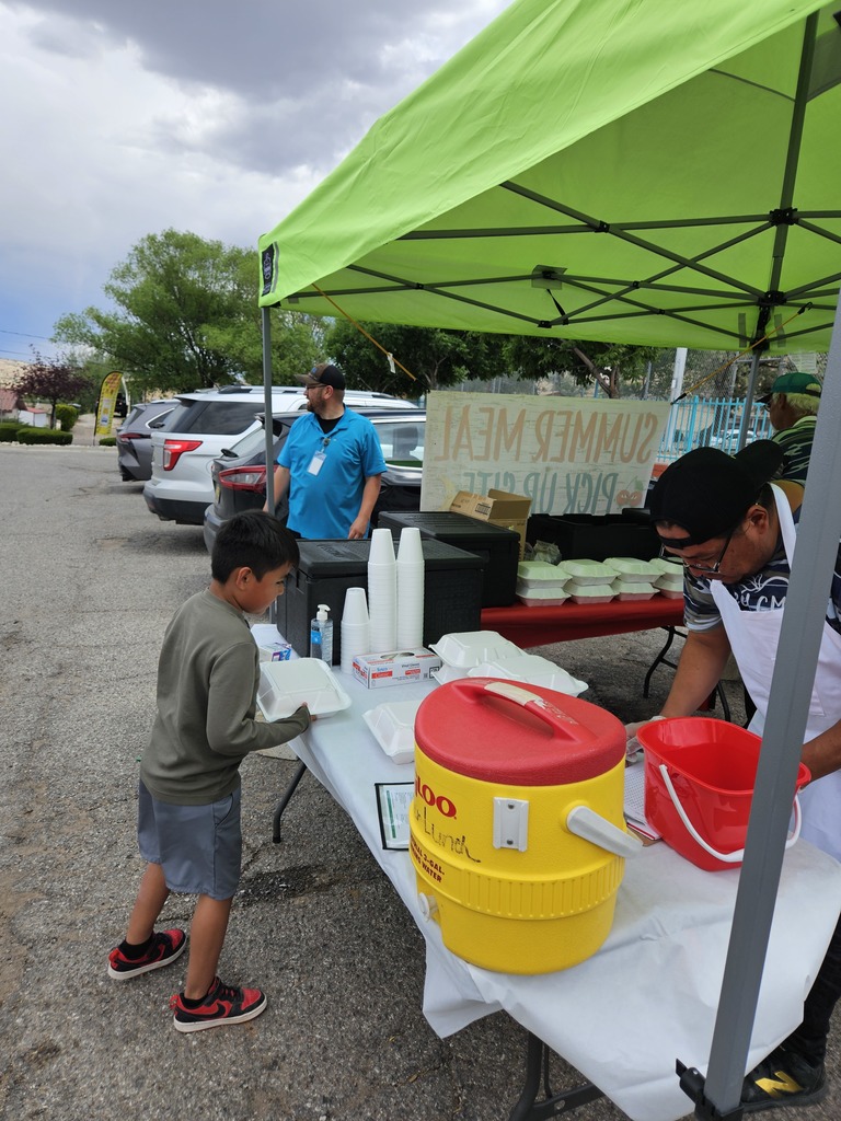 SFE staff feeding students