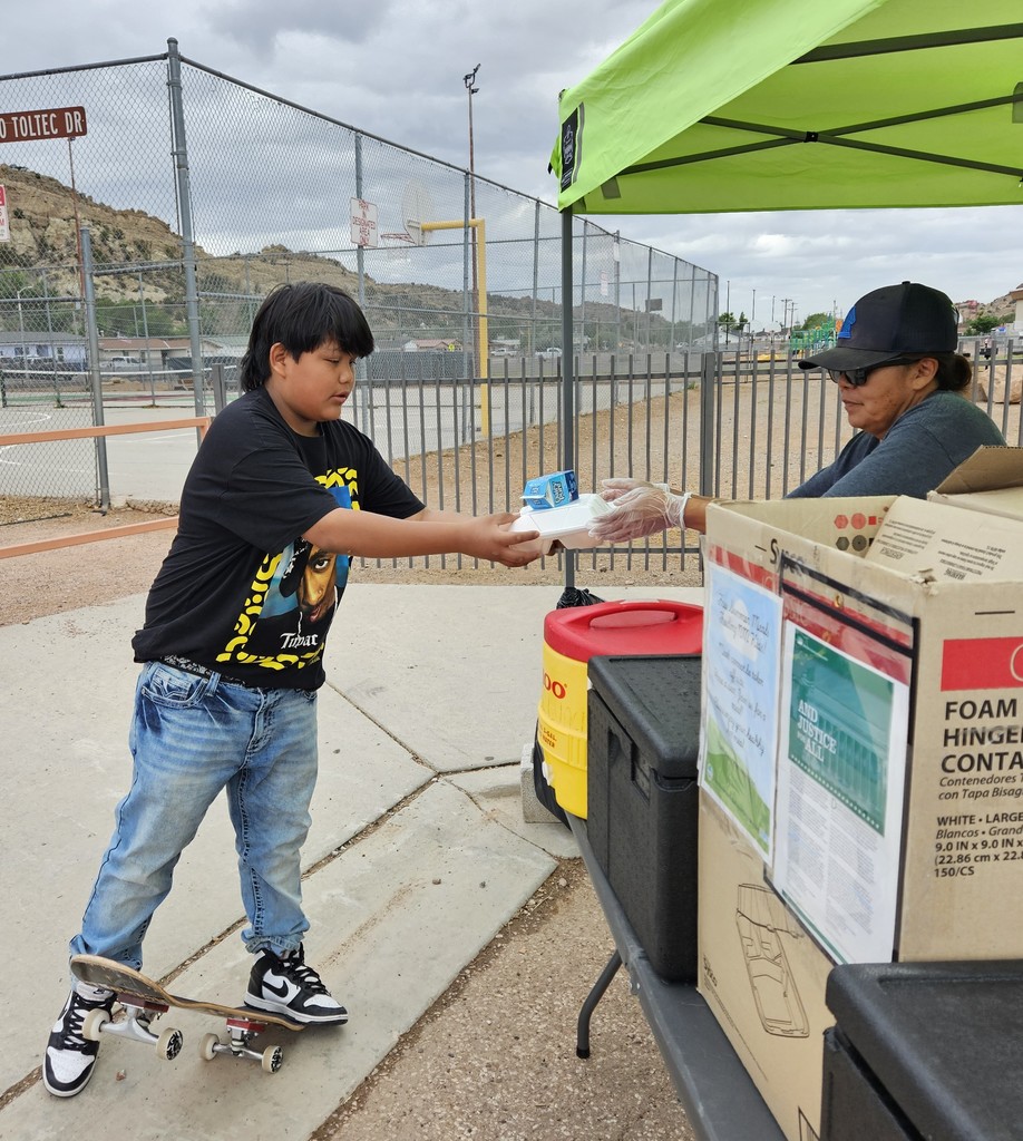SFE staff feeding students