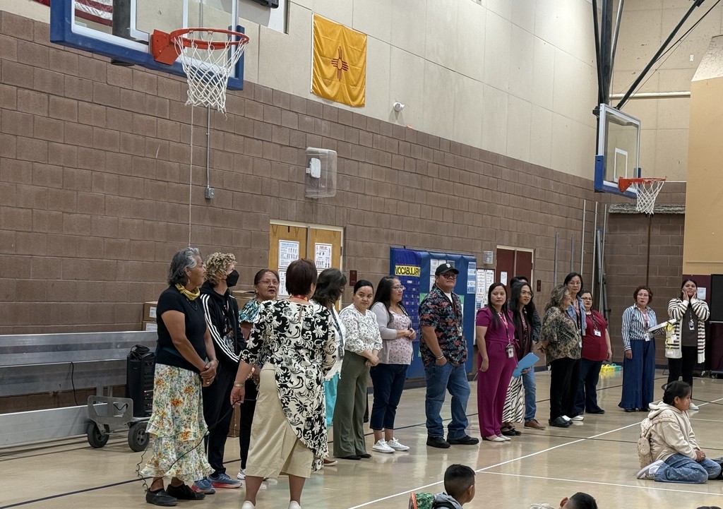 Picture of teachers lined up after introductions and facing students and parents. 