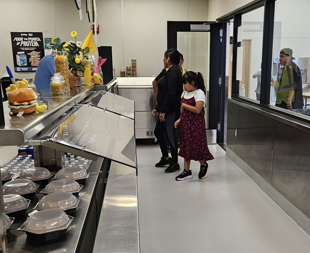 family in line for food