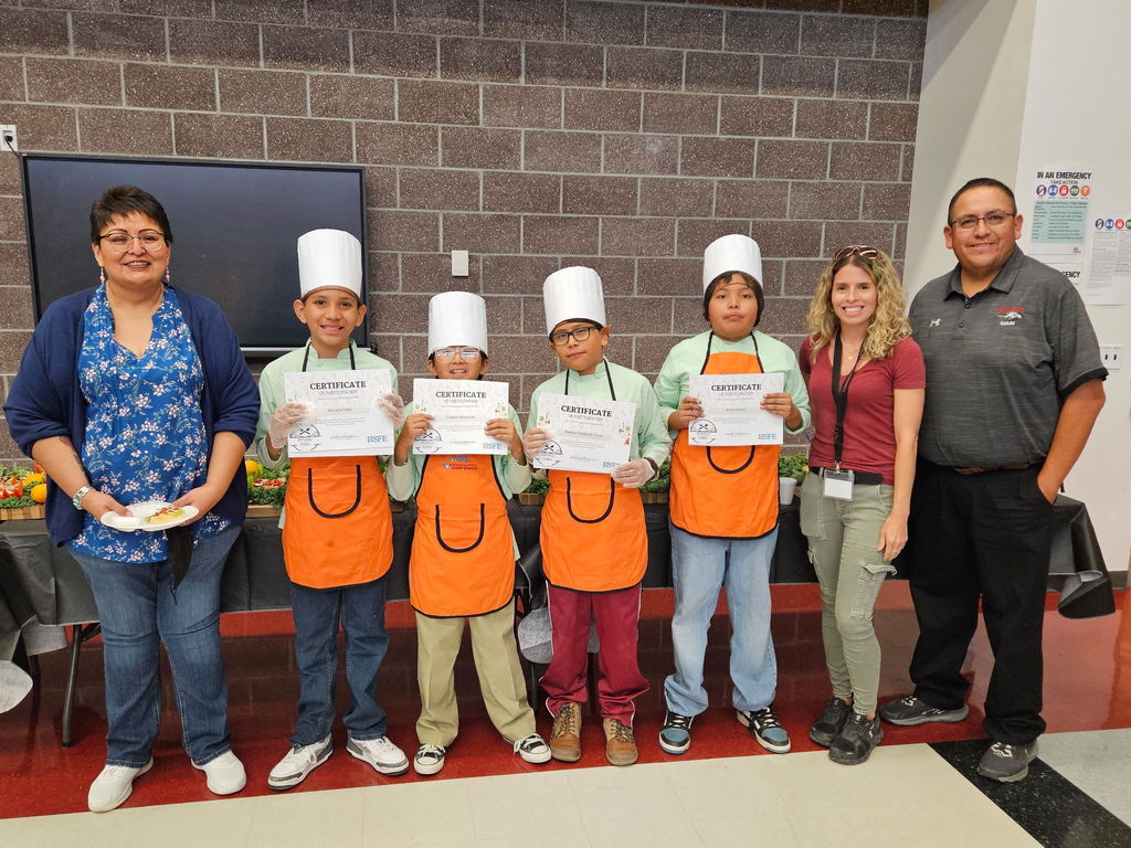 students holding certificates from being a Roving Chef