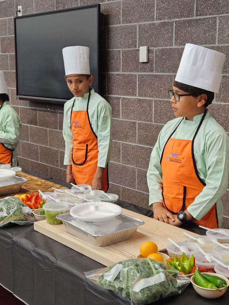 students ready to be little chefs