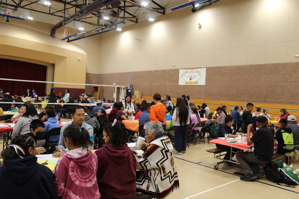 Wide angle lens of all students and grandparents in the gym.