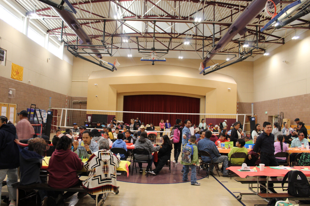 Wide angle gym photo showing all students and grandparents that participated in grandparents day.