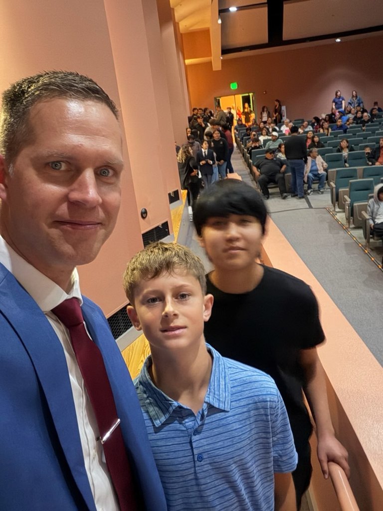 Mr. Gibbons with two students