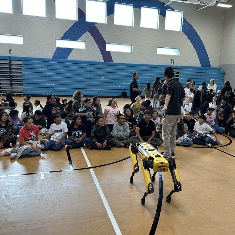 robot dog being presented to many students