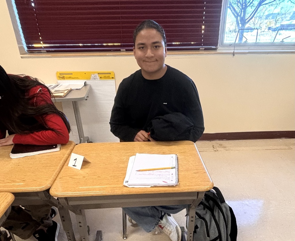 students discussing and working on bills