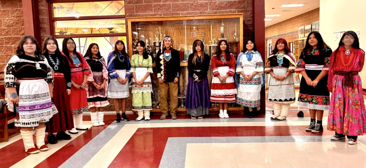 students from all ages dressed traditionally .