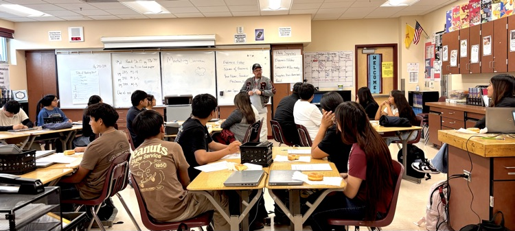 Kyle Briggs talking to the Sophomores about a company’s brand