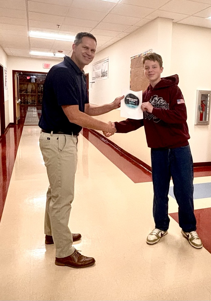 Principal gibbons congratulating Owen