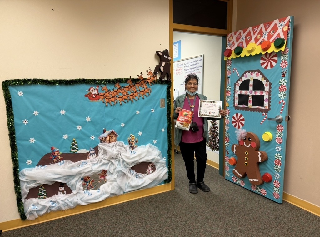 Ms. Begay's door features Santa and his reindeer, a hilltop, and a gingerbread man