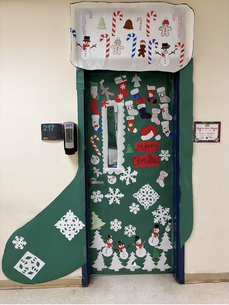 Mrs. Garcia's door looks like a stocking with snowmen, more stockings, and snowflakes