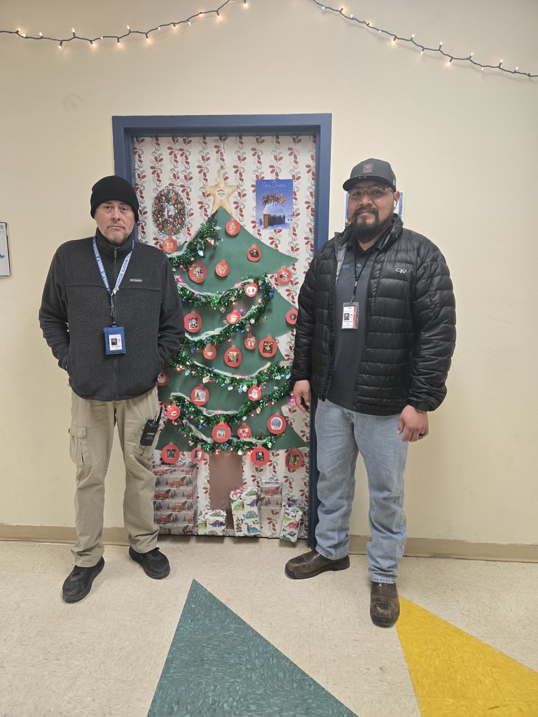 Mr. Mark and Mr. Wallace's door plays music and has  a Christmas tree with real lights.