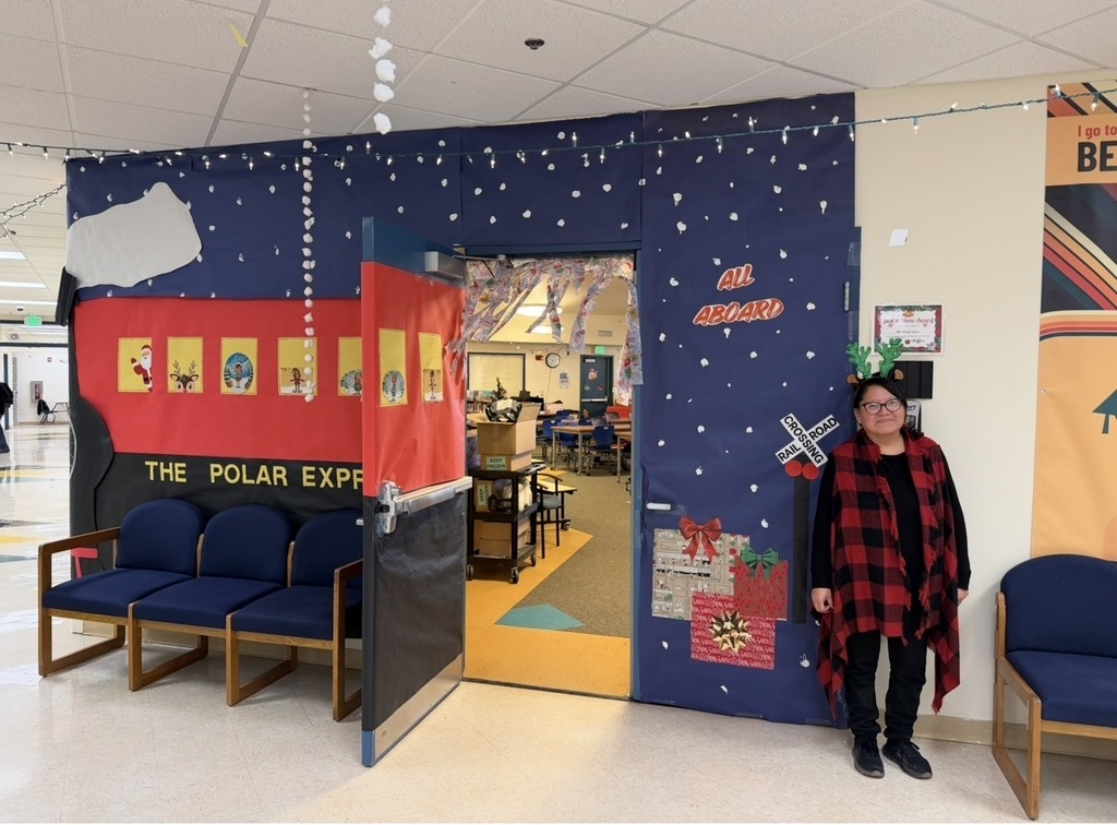 Mrs. Owen's door is the whole Polar Express with the staff as elves