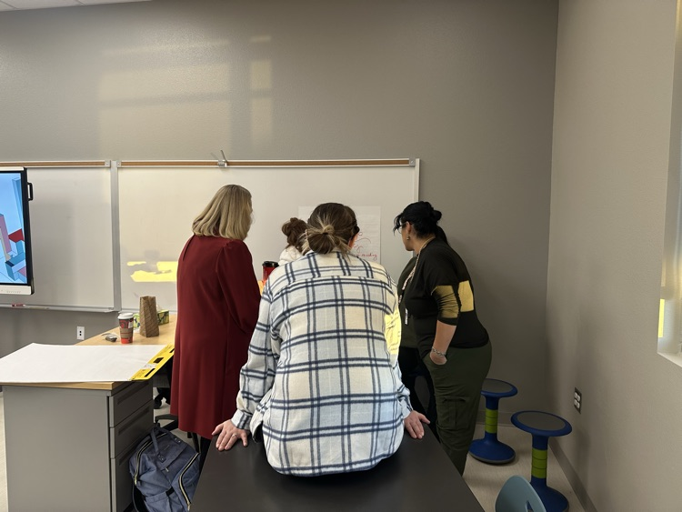 teachers creating their poster in PLCs