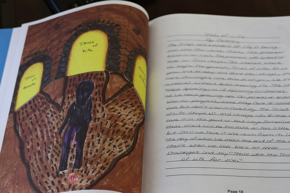 Student art work to the left and poem to the right called trials of life