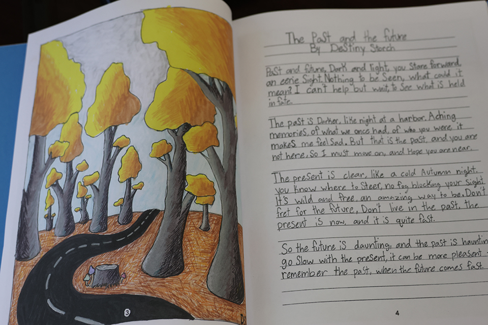 Students art work to the left and poem to the right called the past and the future