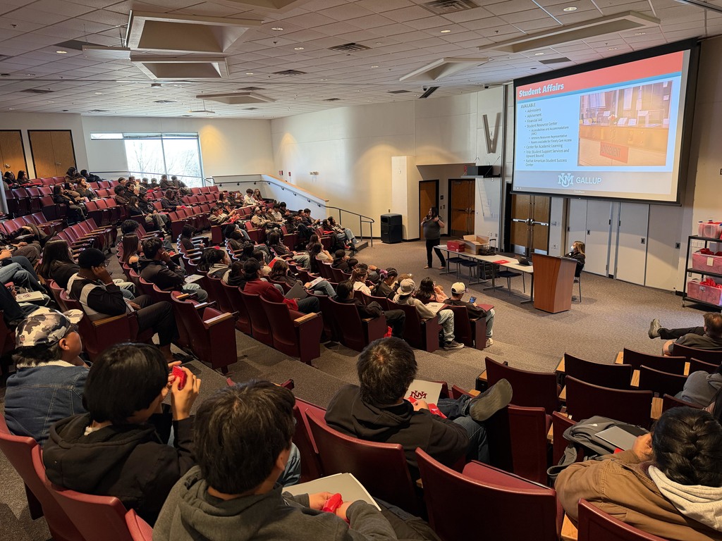 students sit for a presentation