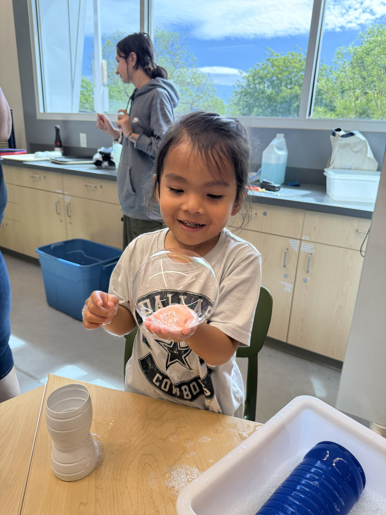 child holding bubble