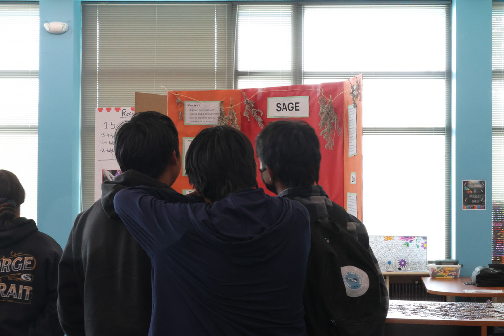 people looking at poster