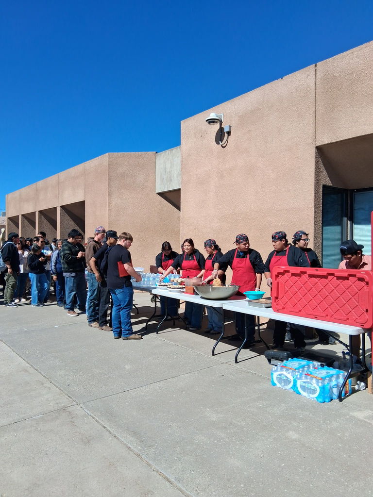 line of people waiting to eat