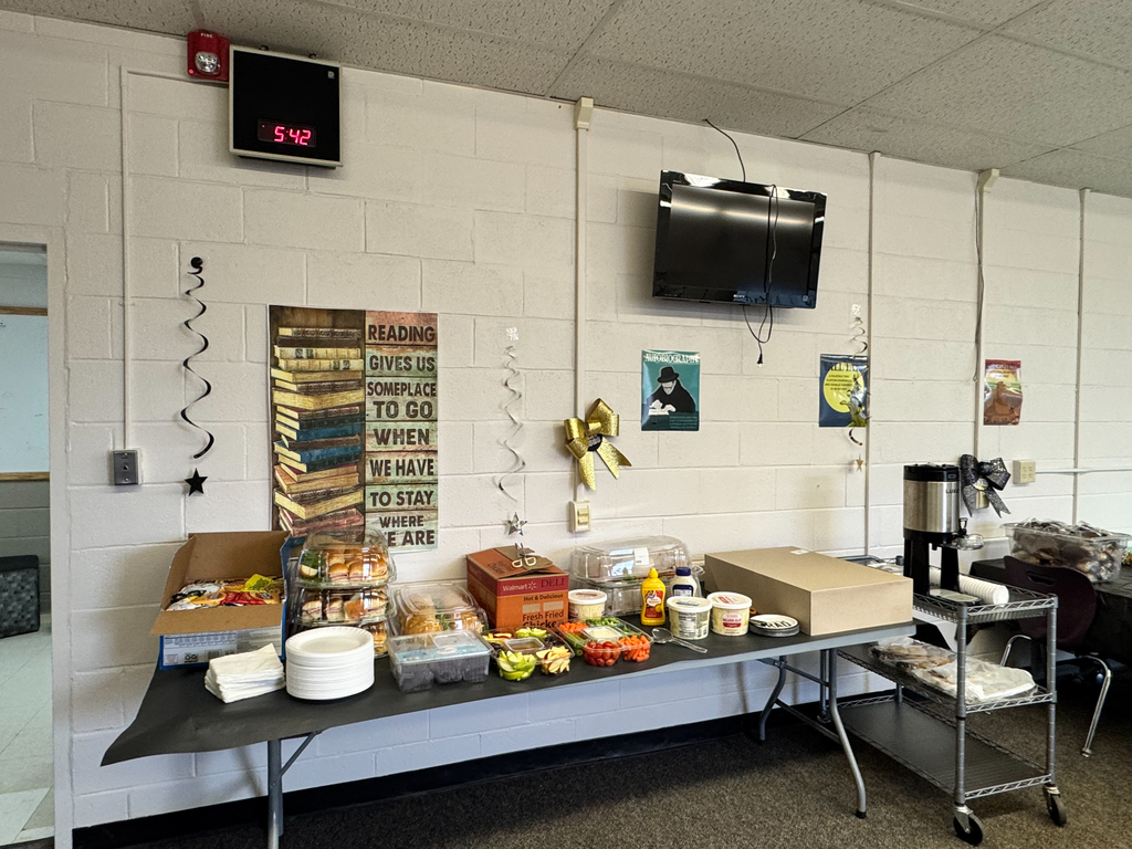 Table of goodies and food and beverages set up for Senior Family Night