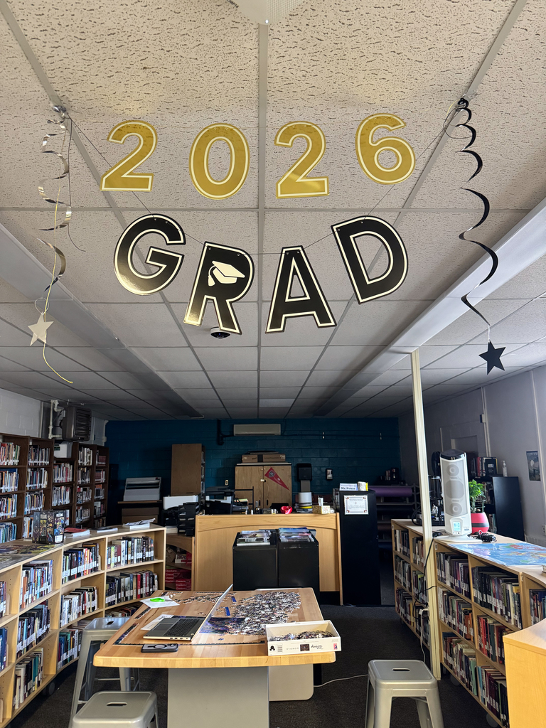 2026 Grad streamers place in the ceiling hanging down in the center of library