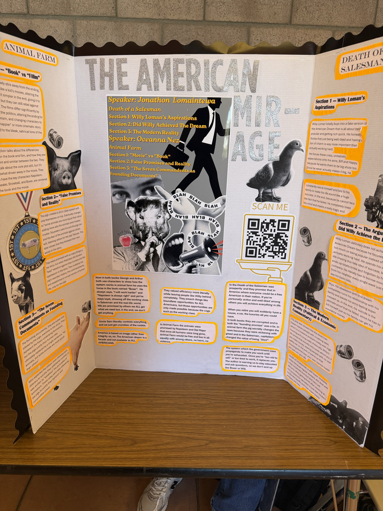 Display on a wooden table with text and images. A large poster shows people, animals, and a QR code.