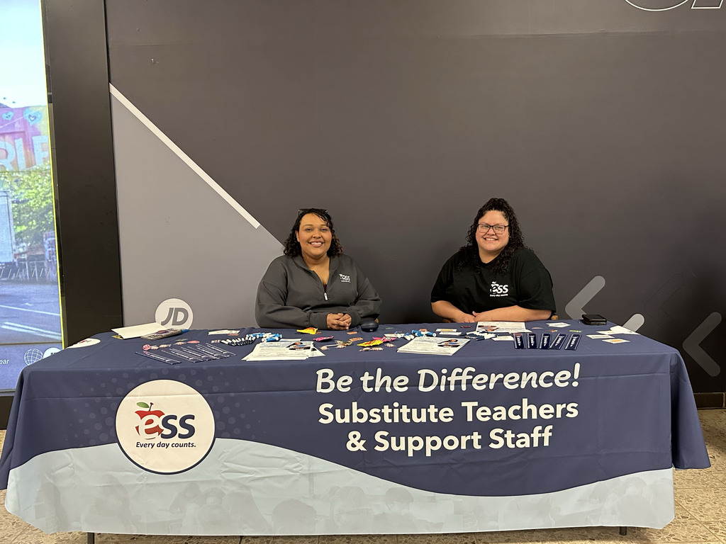 two people sitting at booth