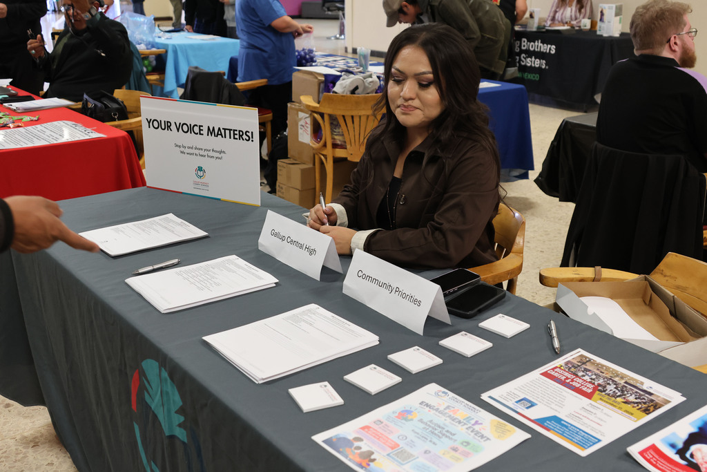 person sitting at booth