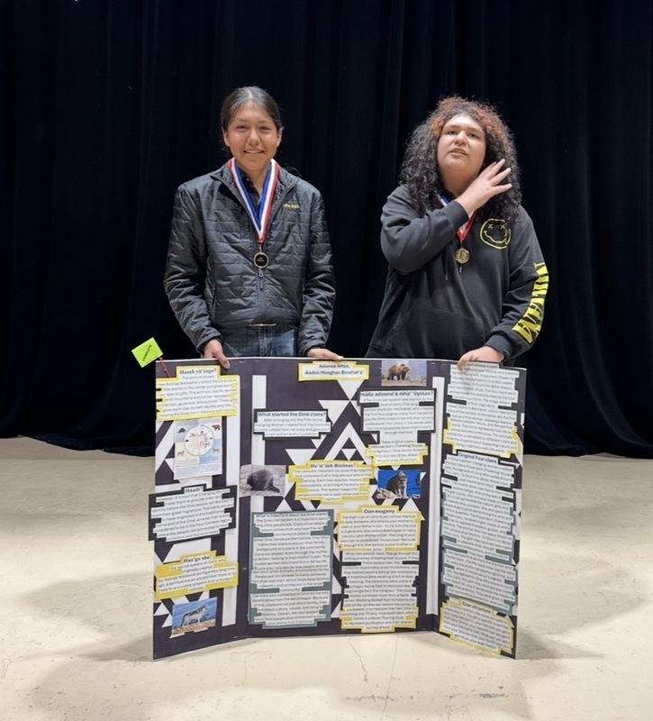 black background, students, trifold project