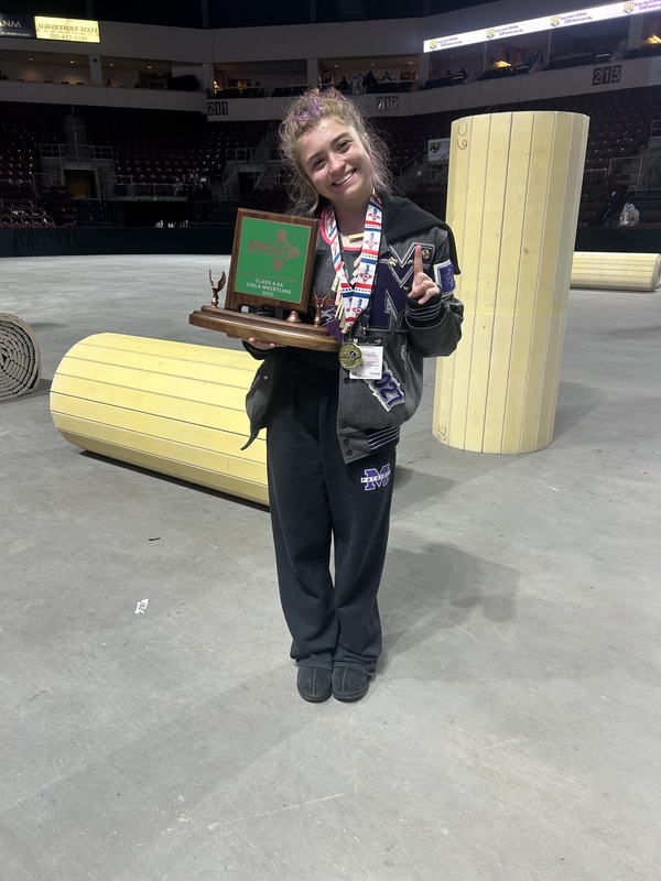 Alexis Morales holds her trophy