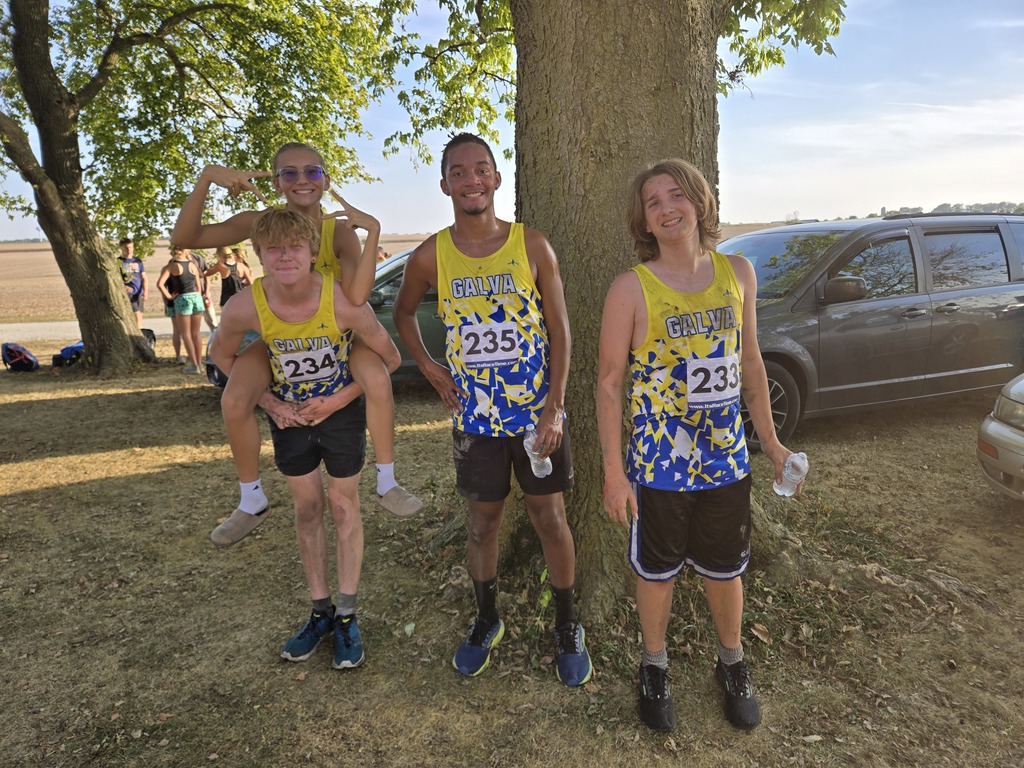 The cross country team muddy after their race