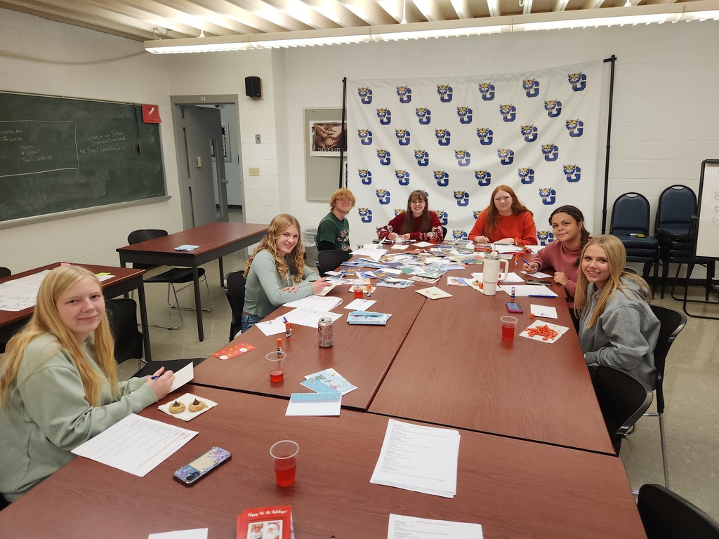 Interact students writing cards