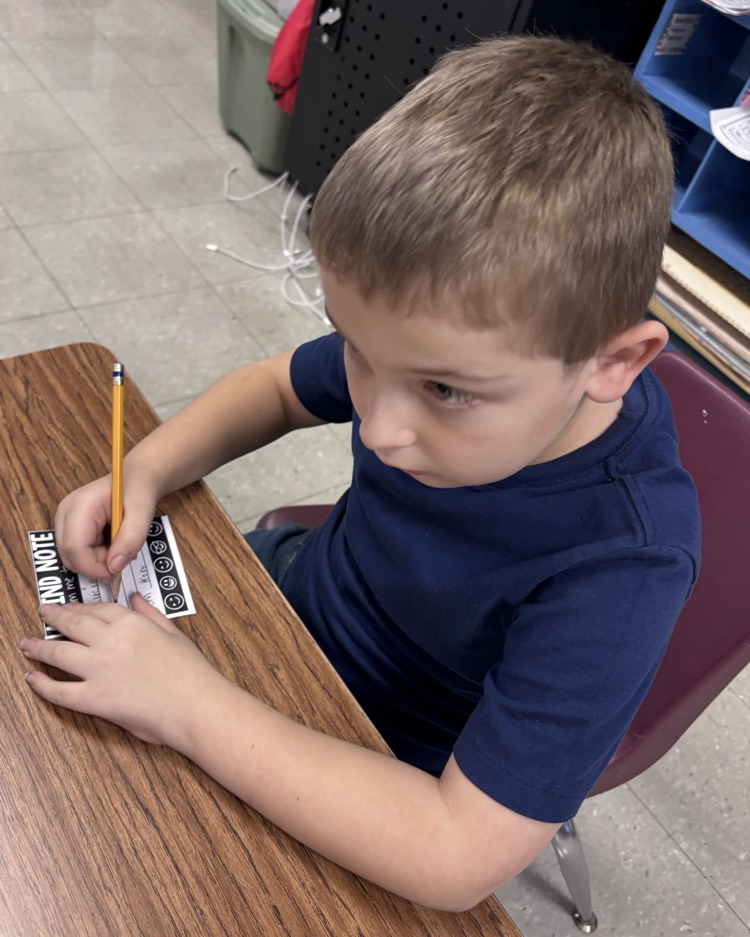 boy writing a note