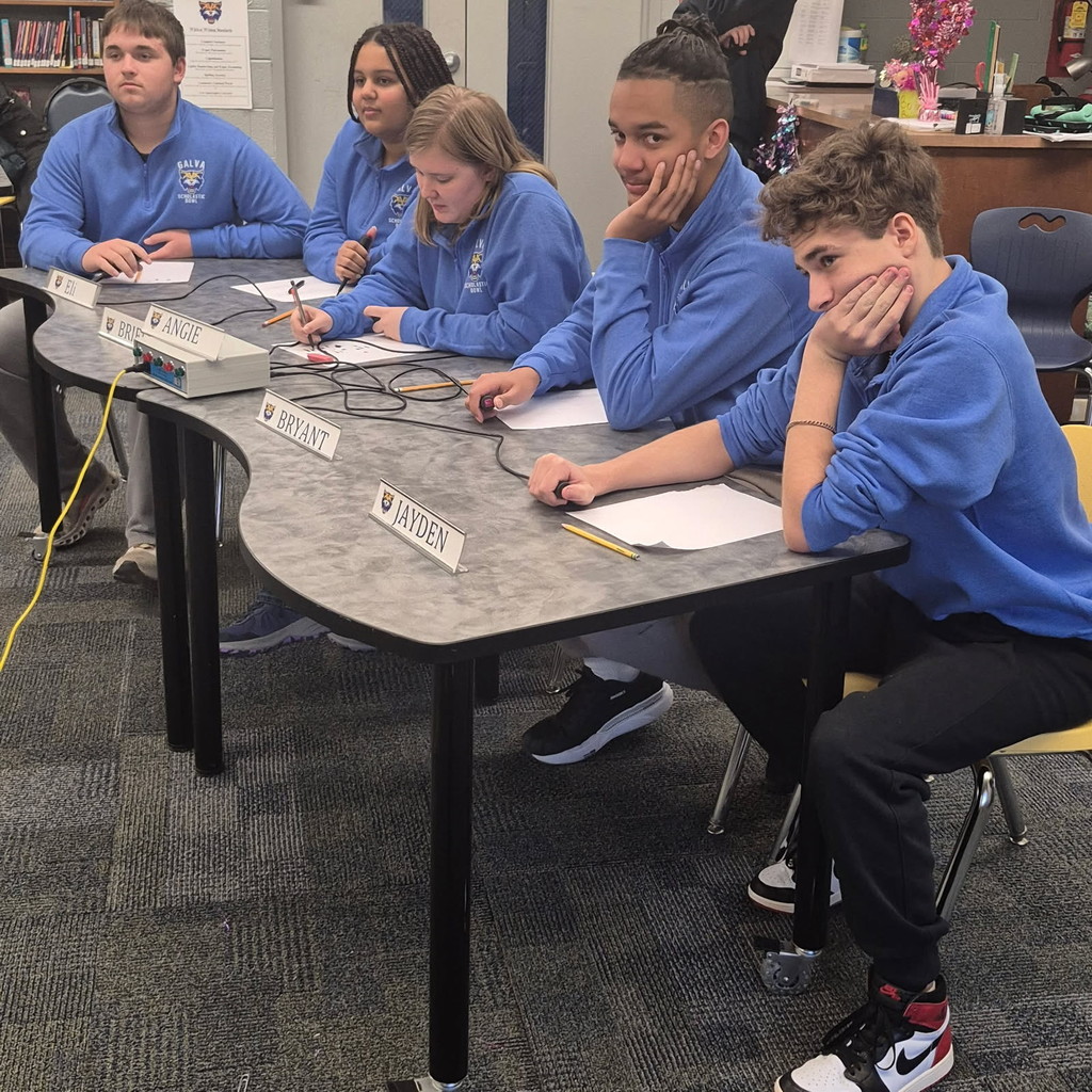 scholastic bowl students at a table with buzzers