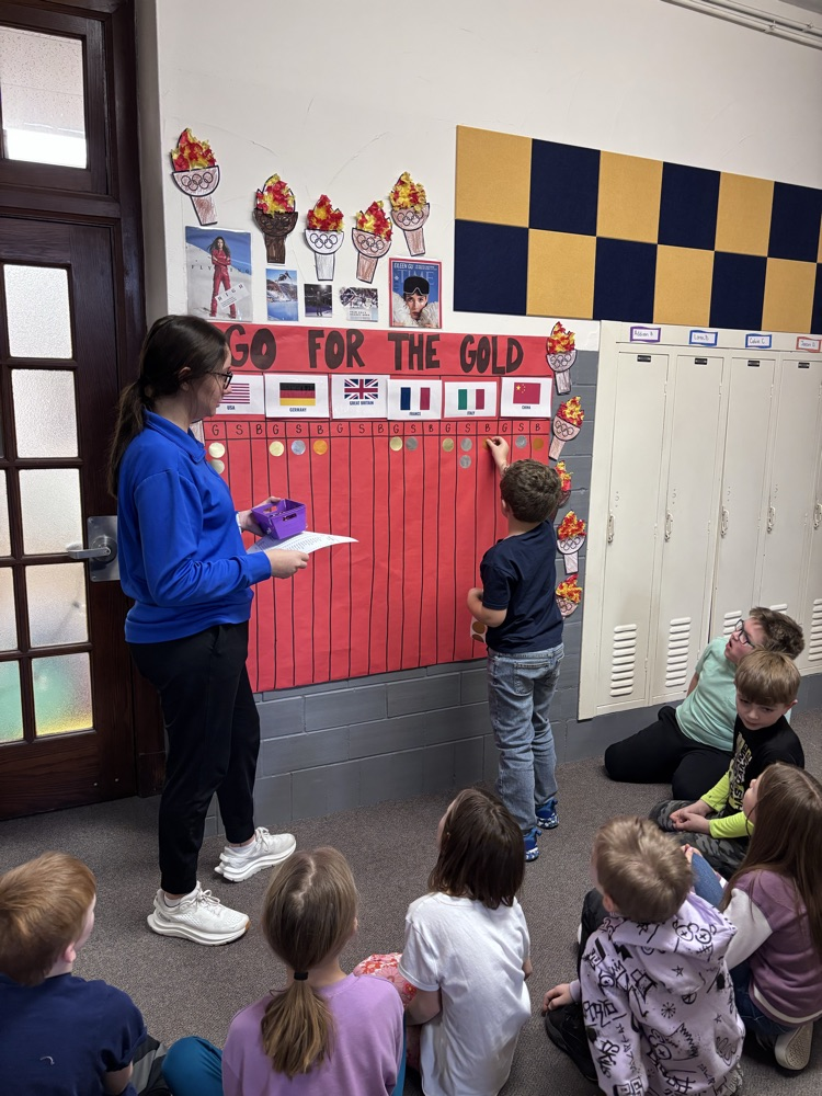 Child, putting stickers on a chart