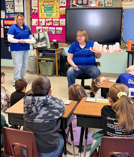 Amy & Shelli teaching 4th grade about the importance of keeping our teeth healthy.