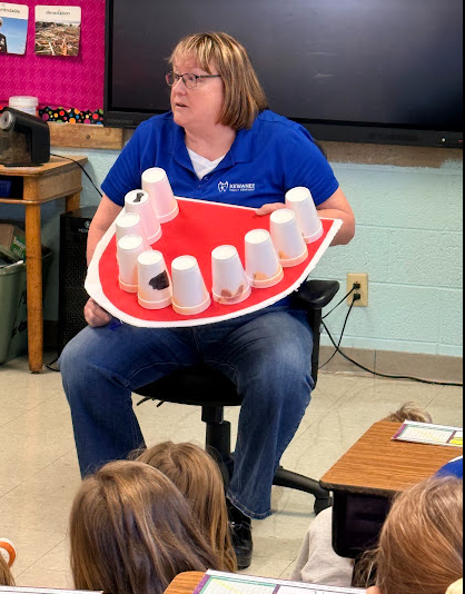 Shelli showing the students what poor dental hygiene looks like.
