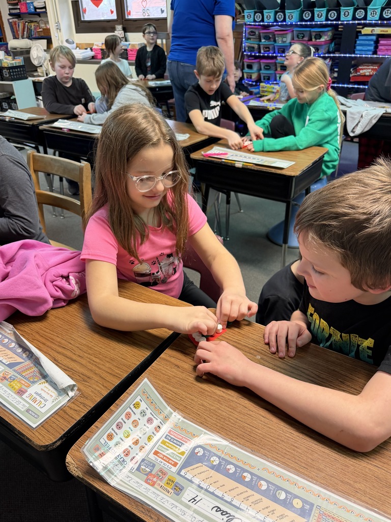 3rd Grade learning the proper way to floss their teeth.