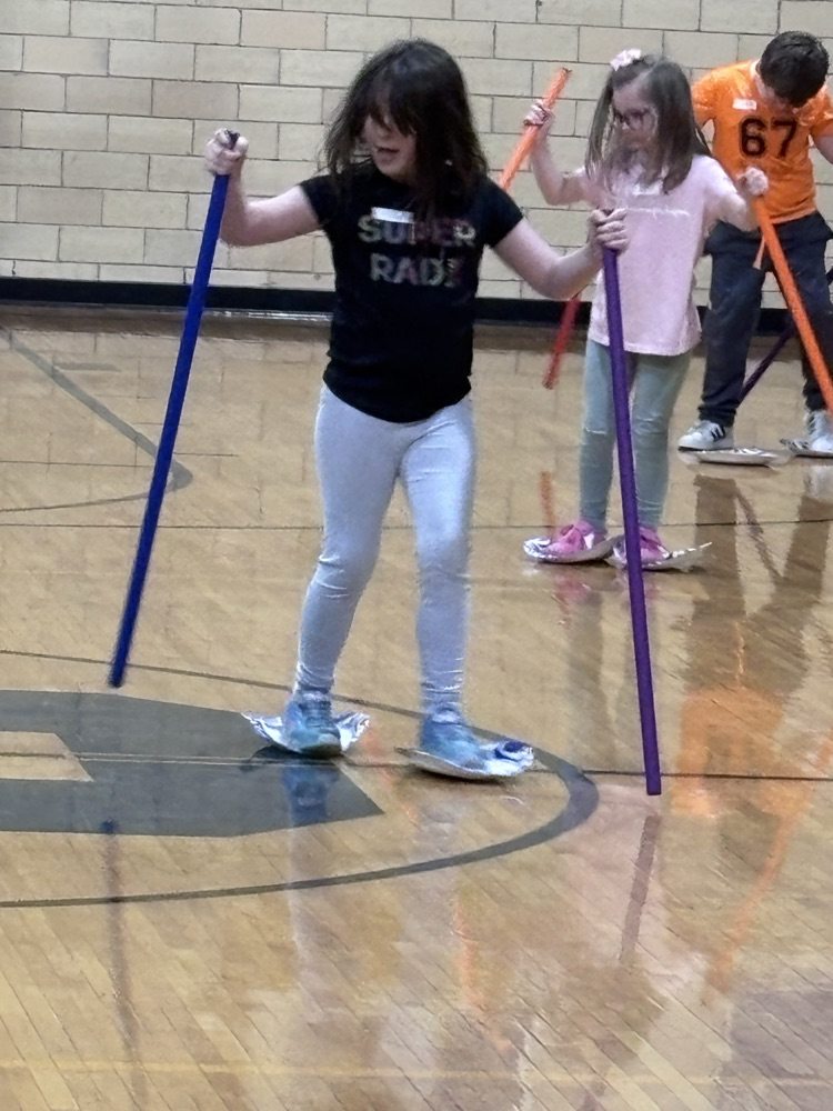 child pretending to ski