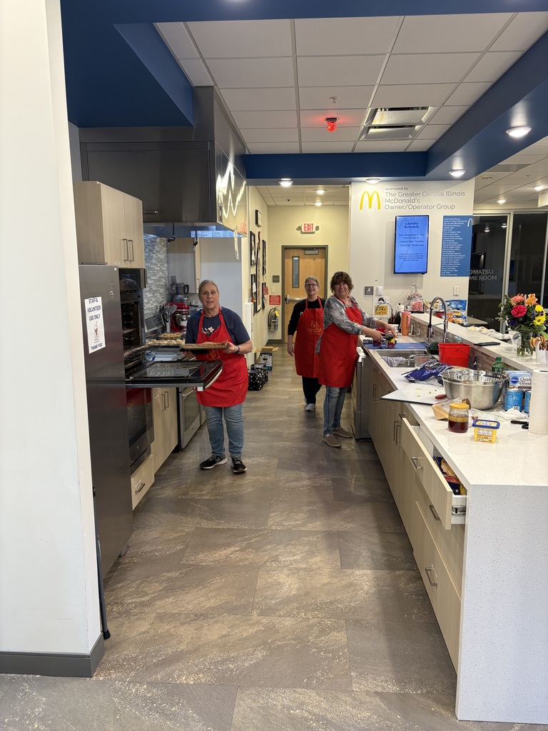 Volunteers preparing dinner for families.