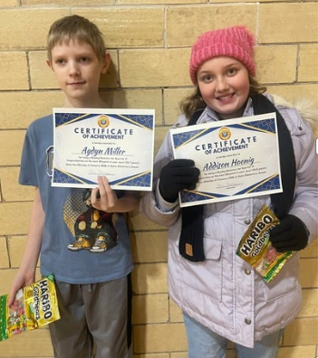 Student with awards for reading the most books