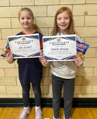 Student with awards for reading the most books