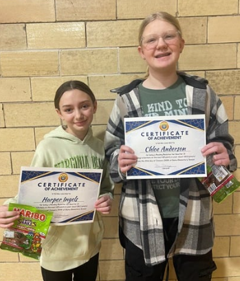 Student with awards for reading the most books